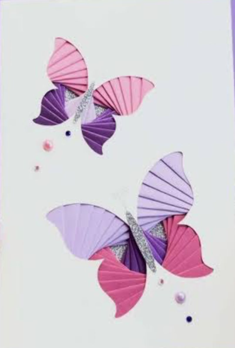 Two iris-folded butterflies in pink and purple